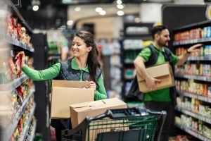 grocery workers stocking shelves